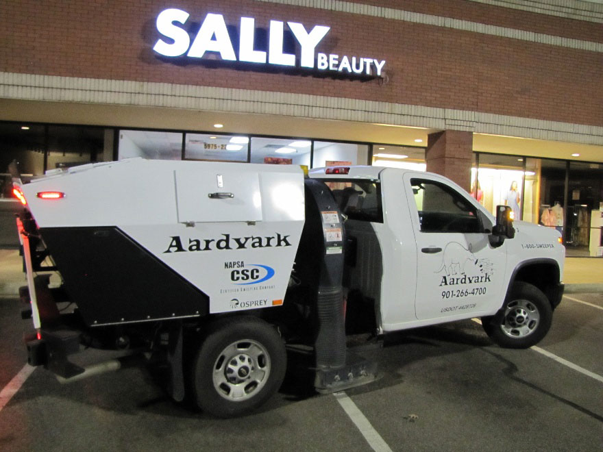 Aardvark sweeping a retail parking lot in Memphis