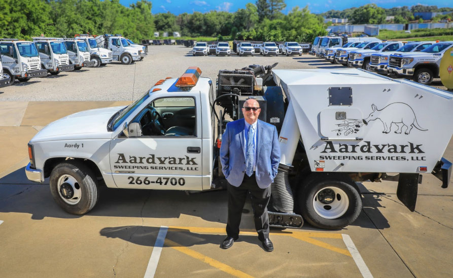 Aardvark founder Carl Barton with the sweeper truck fleet in Memphis
